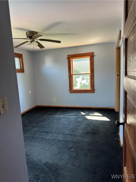 45 Clio Ave, Buffalo, NY 14220 - empty room with dark colored carpet and ceiling fan
