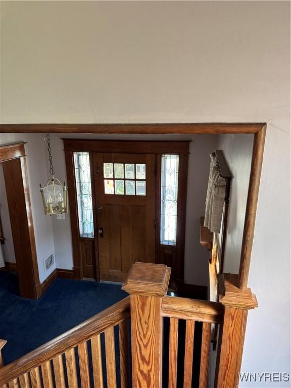 45 Clio Ave, Buffalo, NY 14220 - carpeted foyer with baseboards and a chandelier