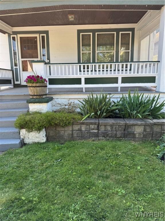 45 Clio Ave, Buffalo, NY 14220 - property entrance featuring a porch and a yard