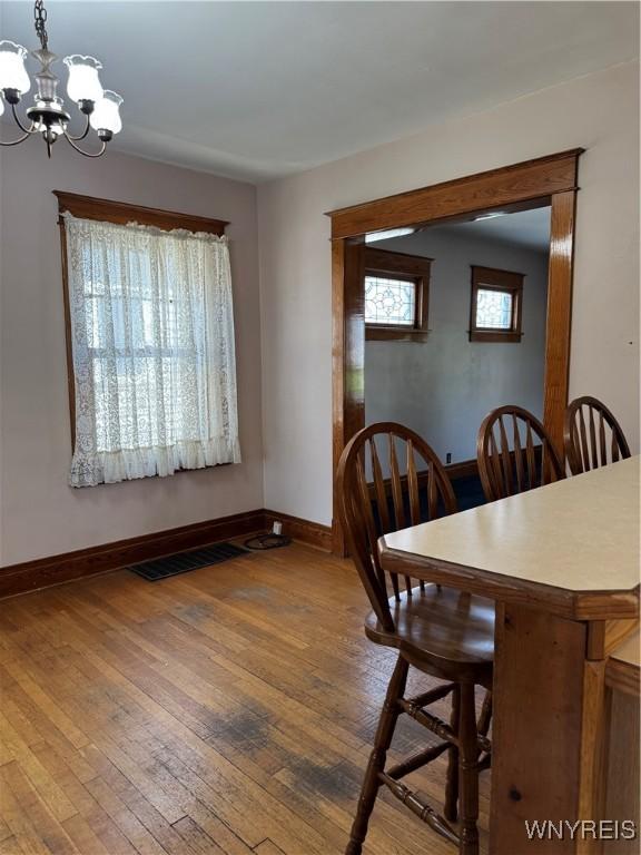 45 Clio Ave, Buffalo, NY 14220 - dining space with a chandelier and hardwood / wood-style floors