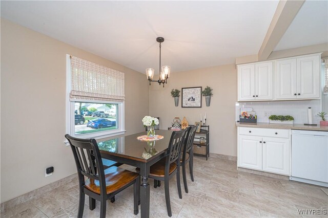 282 N Wrexham Ct, Tonawanda, NY 14150 - dining room featuring a chandelier and baseboards