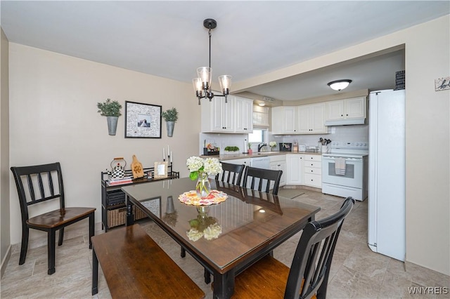 282 N Wrexham Ct, Tonawanda, NY 14150 - dining room featuring a chandelier