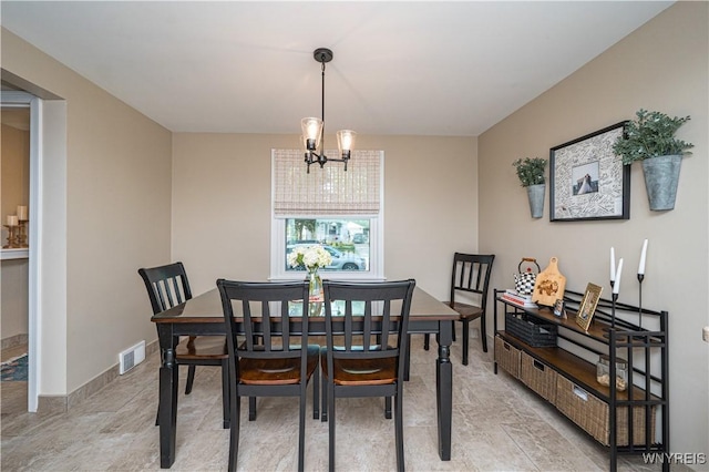 282 N Wrexham Ct, Tonawanda, NY 14150 - dining area featuring a chandelier and baseboards
