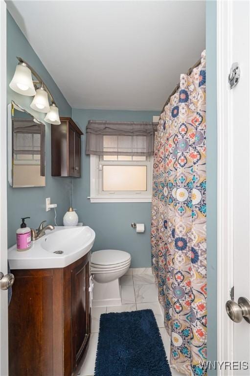 282 N Wrexham Ct, Tonawanda, NY 14150 - full bathroom featuring vanity, marble finish floors, and a shower with curtain