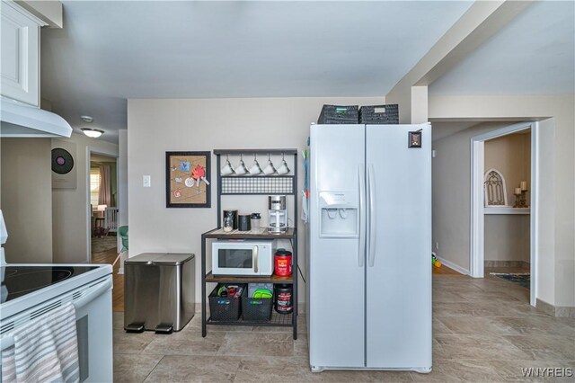 282 N Wrexham Ct, Tonawanda, NY 14150 - kitchen featuring white appliances and ventilation hood