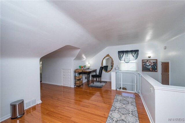 282 N Wrexham Ct, Tonawanda, NY 14150 - bonus room featuring wood finished floors and vaulted ceiling