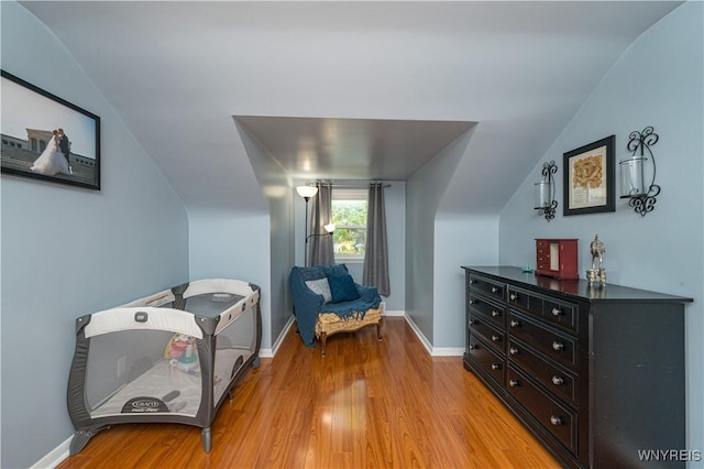 282 N Wrexham Ct, Tonawanda, NY 14150 - sitting room with vaulted ceiling and light wood-style flooring