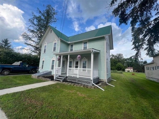 1574 Pine St, Woodhull, NY 14898 - view of front facade with covered porch, a front yard, and a metal roof