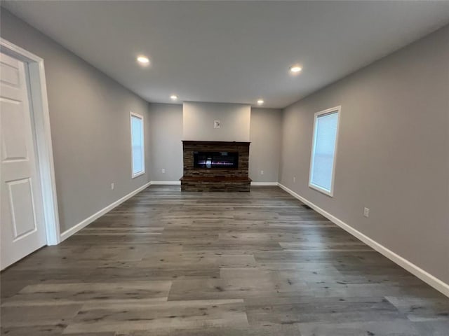 1574 Pine St, Woodhull, NY 14898 - unfurnished living room featuring a glass covered fireplace, recessed lighting, and wood finished floors