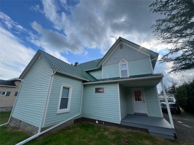 1574 Pine St, Woodhull, NY 14898 - back of property with a metal roof, covered porch, and a standing seam roof