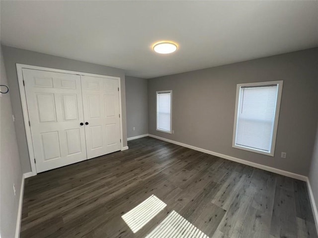 1574 Pine St, Woodhull, NY 14898 - unfurnished bedroom with dark wood finished floors and a closet