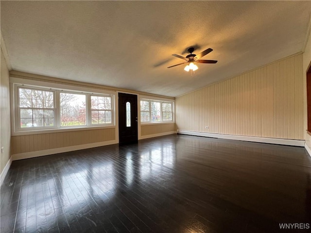 60 Waltham Ave, Lancaster, NY 14086 - unfurnished living room with a baseboard radiator, ceiling fan, vaulted ceiling, dark wood-style floors, and a textured ceiling