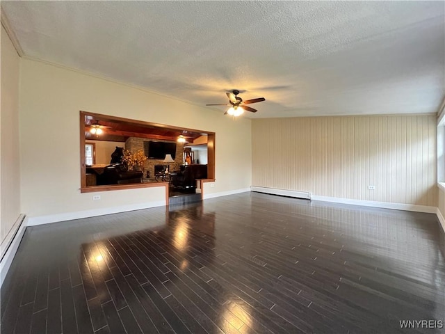 60 Waltham Ave, Lancaster, NY 14086 - unfurnished living room featuring a ceiling fan, wood finished floors, baseboard heating, and a textured ceiling
