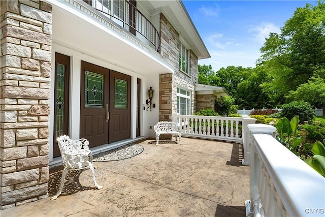 5 Hingham Rd, Utica, NY 13501 - doorway to property featuring stone siding and a porch