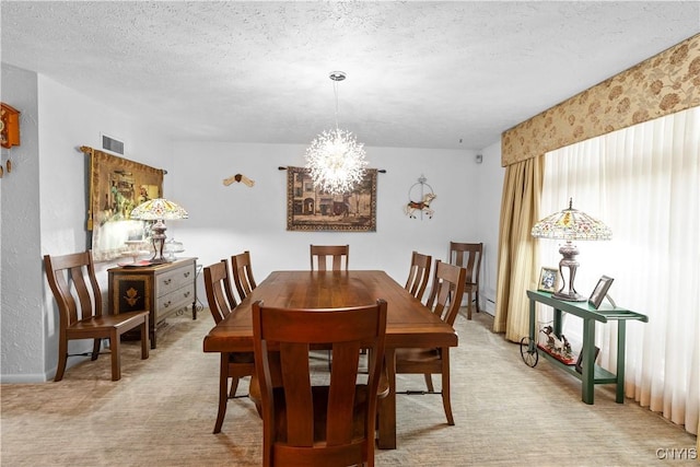 5 Hingham Rd, Utica, NY 13501 - dining space with a chandelier, light carpet, and a textured ceiling