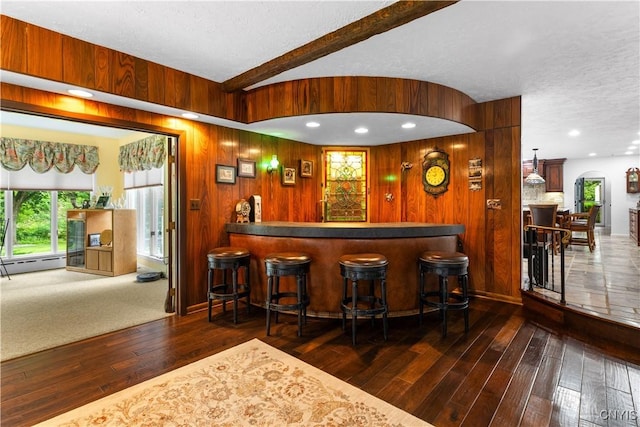 5 Hingham Rd, Utica, NY 13501 - indoor dry bar featuring hardwood / wood-style floors, baseboard heating, a textured ceiling, wood walls, and lofted ceiling