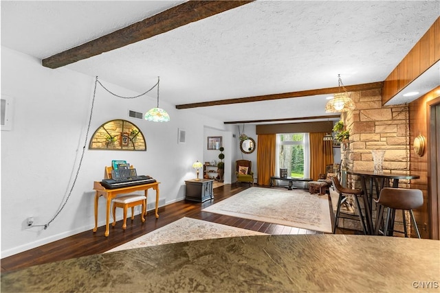 5 Hingham Rd, Utica, NY 13501 - living area featuring hardwood / wood-style flooring, beamed ceiling, and a textured ceiling