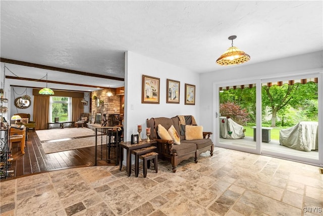 5 Hingham Rd, Utica, NY 13501 - living room featuring stone tile floors and a textured ceiling