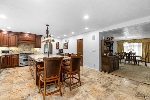 5 Hingham Rd, Utica, NY 13501 - dining space with stone tile floors, recessed lighting, and a chandelier