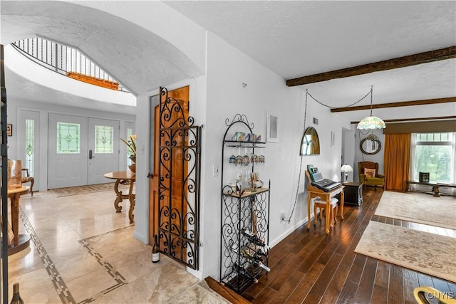 5 Hingham Rd, Utica, NY 13501 - foyer with arched walkways, a textured ceiling, and wood finished floors