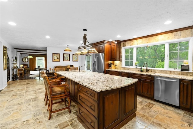 5 Hingham Rd, Utica, NY 13501 - kitchen with appliances with stainless steel finishes, light stone finish flooring, recessed lighting, light stone countertops, and a center island