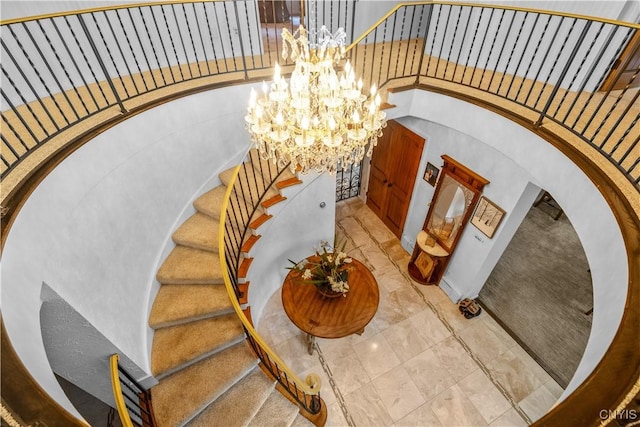 5 Hingham Rd, Utica, NY 13501 - staircase with a chandelier and arched walkways