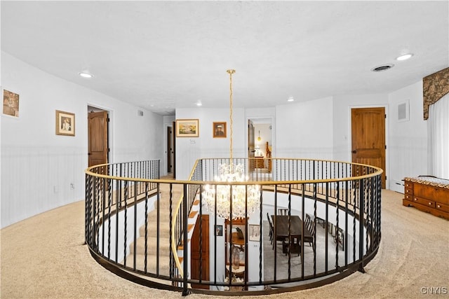 5 Hingham Rd, Utica, NY 13501 - hall with an upstairs landing, carpet flooring, recessed lighting, a baseboard radiator, and wainscoting