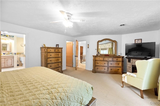 5 Hingham Rd, Utica, NY 13501 - bedroom with light carpet, a textured ceiling, ensuite bath, and ceiling fan