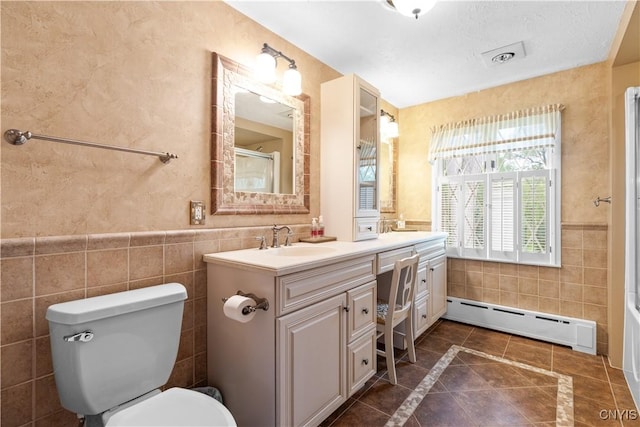 5 Hingham Rd, Utica, NY 13501 - bathroom with a baseboard heating unit, tile walls, vanity, a shower, and inlaid floor details