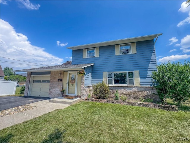 8 Harnden St, Auburn, NY 13021 - traditional-style home featuring driveway, an attached garage, a front yard, and stone siding