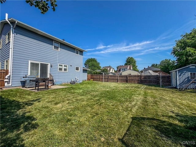 8 Harnden St, Auburn, NY 13021 - fenced backyard featuring a storage unit and a patio