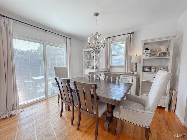8 Harnden St, Auburn, NY 13021 - dining space with a chandelier and light wood finished floors