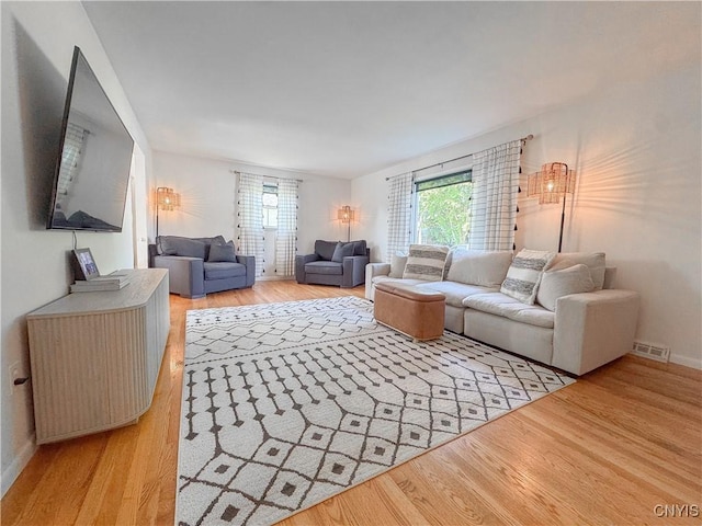 8 Harnden St, Auburn, NY 13021 - living area featuring light wood-style floors and baseboards