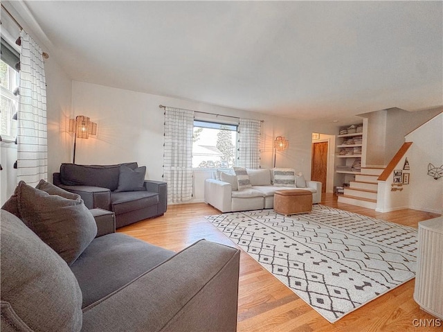 8 Harnden St, Auburn, NY 13021 - living room with wood finished floors and stairway