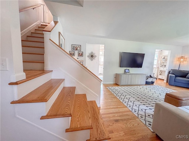 8 Harnden St, Auburn, NY 13021 - living room featuring wood finished floors and stairway