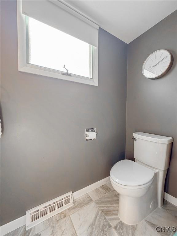 8 Harnden St, Auburn, NY 13021 - bathroom featuring toilet and marble finish floors