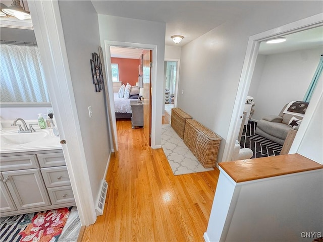 8 Harnden St, Auburn, NY 13021 - hall with a sink and light wood-style flooring