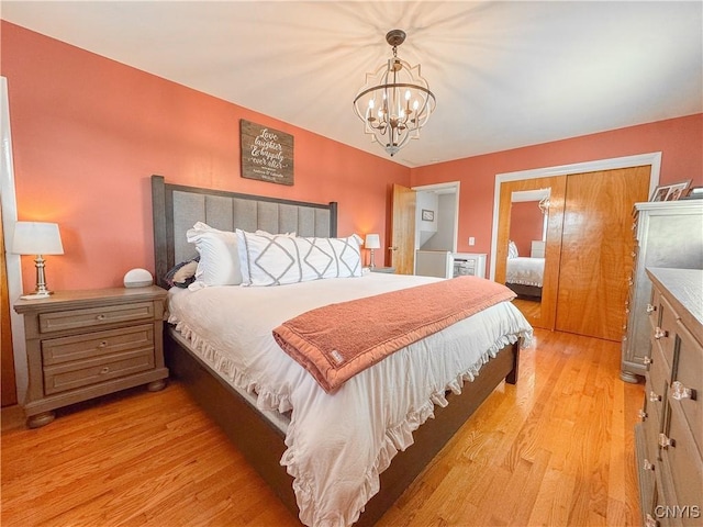 8 Harnden St, Auburn, NY 13021 - bedroom with light wood-style floors and a chandelier