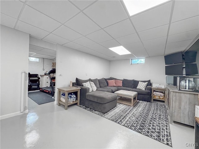 8 Harnden St, Auburn, NY 13021 - living area with concrete flooring and a paneled ceiling