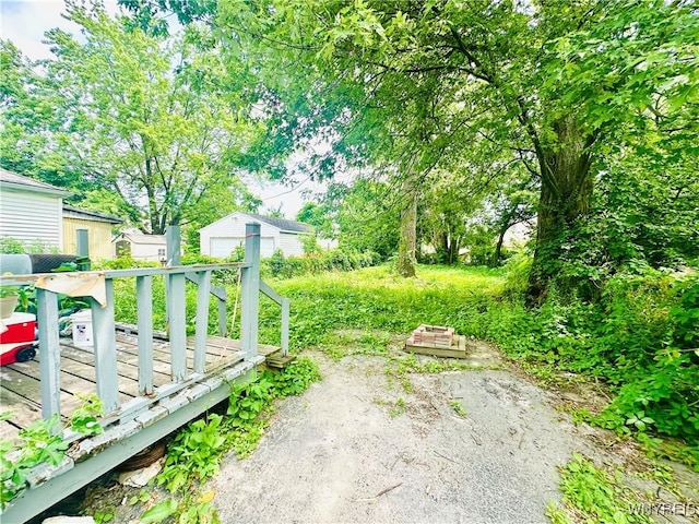 253 Gold St, Buffalo, NY 14206 - view of yard with a deck and an outdoor structure
