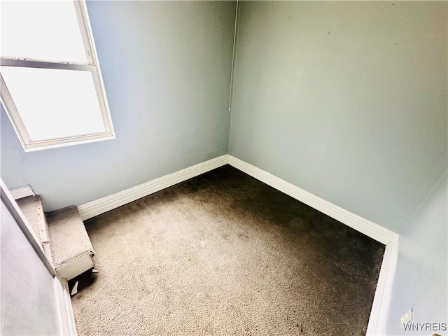 253 Gold St, Buffalo, NY 14206 - spare room featuring baseboards and dark colored carpet