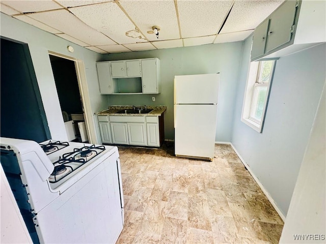 253 Gold St, Buffalo, NY 14206 - kitchen featuring white appliances and a drop ceiling