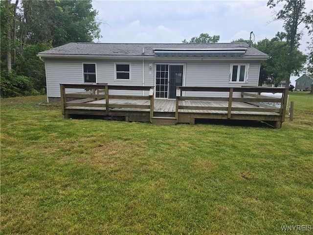 12370 Lake Forest Ln Unit 42, Yates, NY 14098 - back of house with a deck and a lawn