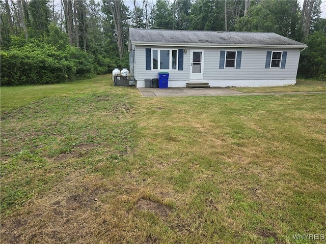 12370 Lake Forest Ln Unit 42, Yates, NY 14098 - view of front facade featuring a patio area and a front yard