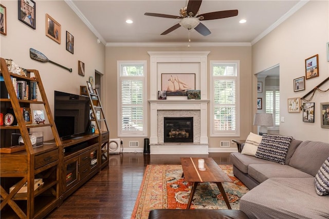 405 Greystone Dr, Horseheads, NY 14845 - living room with dark wood-style flooring, a ceiling fan, plenty of natural light, a glass covered fireplace, and crown molding