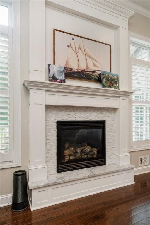 405 Greystone Dr, Horseheads, NY 14845 - detailed view of wood finished floors, a glass covered fireplace, and crown molding
