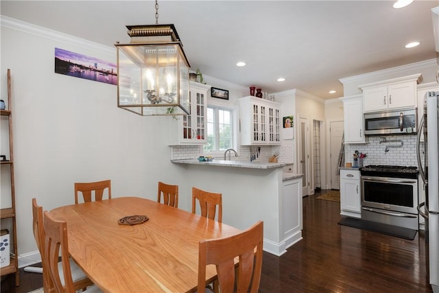 405 Greystone Dr, Horseheads, NY 14845 - dining space with crown molding, dark wood finished floors, and recessed lighting