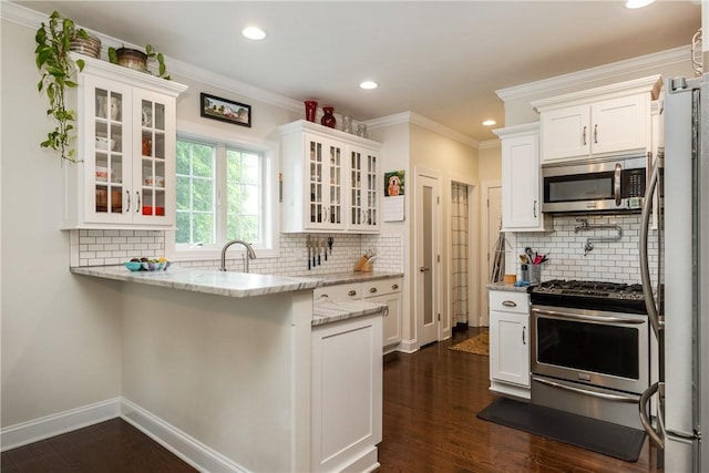405 Greystone Dr, Horseheads, NY 14845 - kitchen with stainless steel appliances, white cabinets, tasteful backsplash, ornamental molding, and recessed lighting
