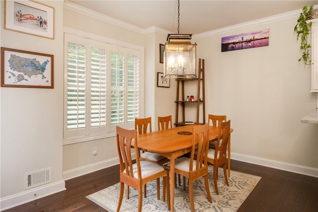 405 Greystone Dr, Horseheads, NY 14845 - dining room featuring dark wood-type flooring, ornamental molding, and a chandelier