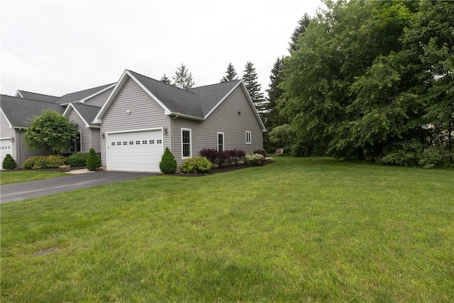 405 Greystone Dr, Horseheads, NY 14845 - view of home's exterior featuring asphalt driveway, a lawn, and a garage